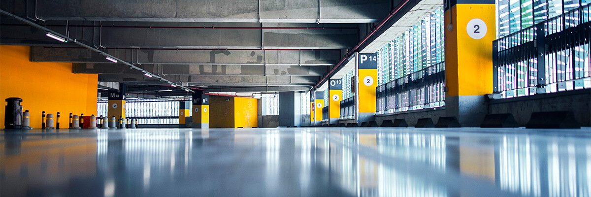 Parking garage with polished concrete flooring.